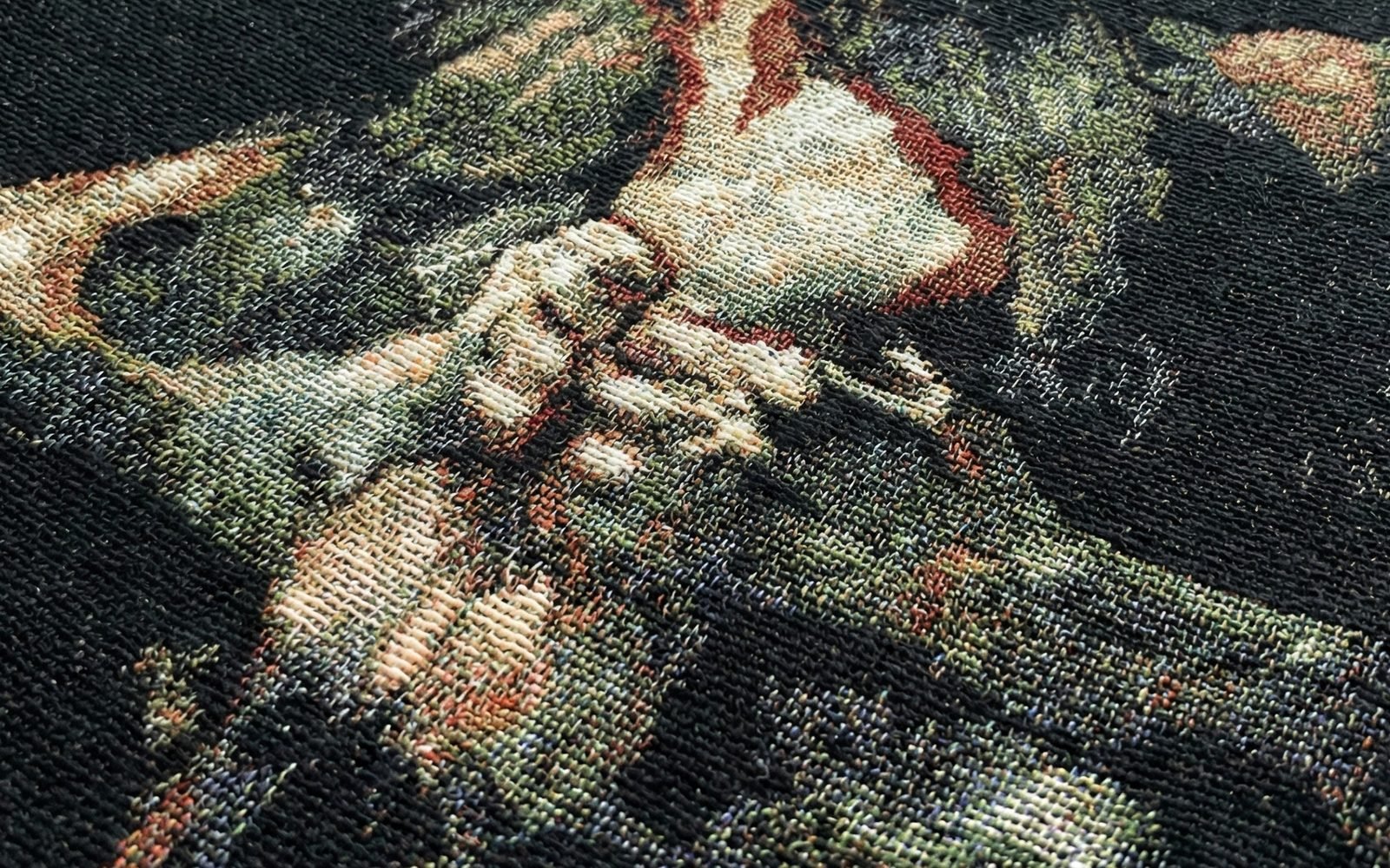 Woven detail of Goya’s Saturn: the god’s hands gripping a pale body, every thread visible.