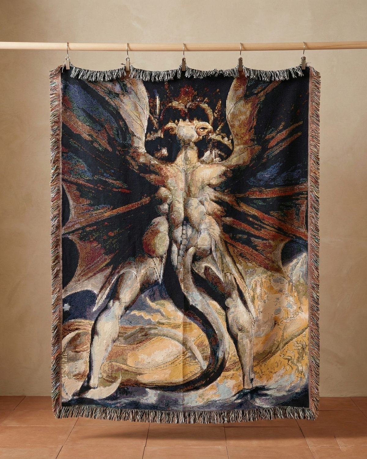 The Great Red Dragon blanket hung from a wooden rail.
